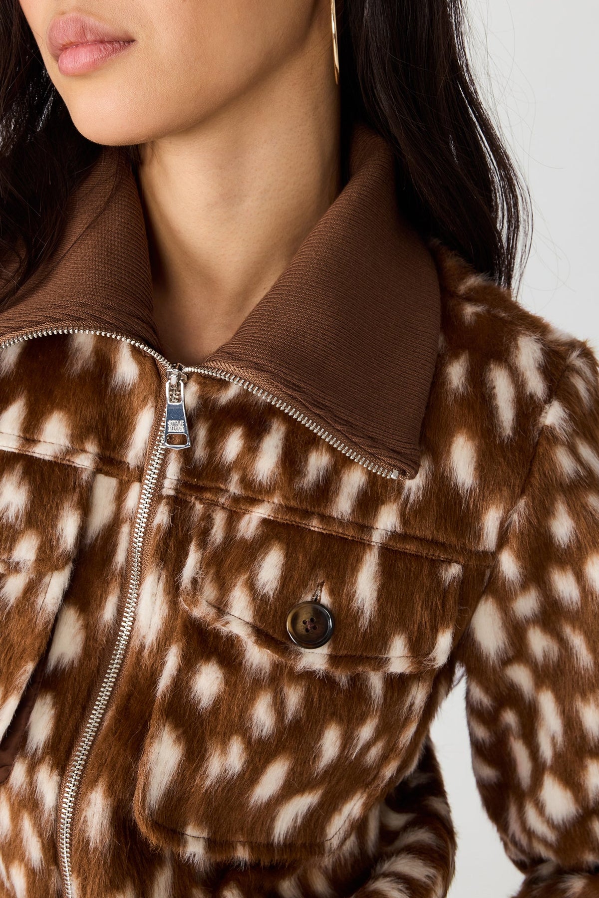 Abstract dot jacket zip and front pocket detail
